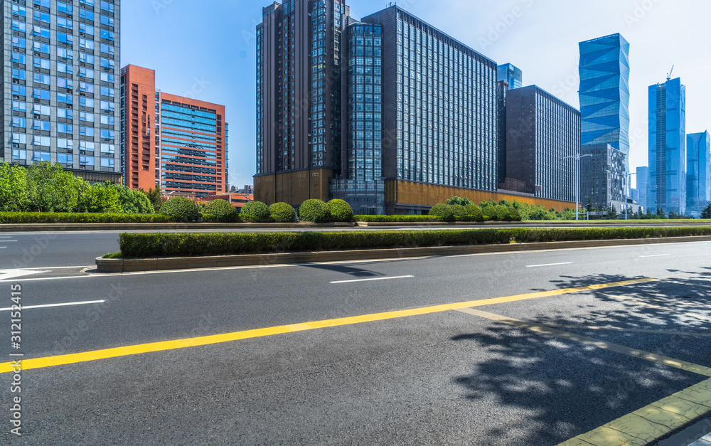 empty urban road with modern building in the city. empty urban road with modern building in the city.