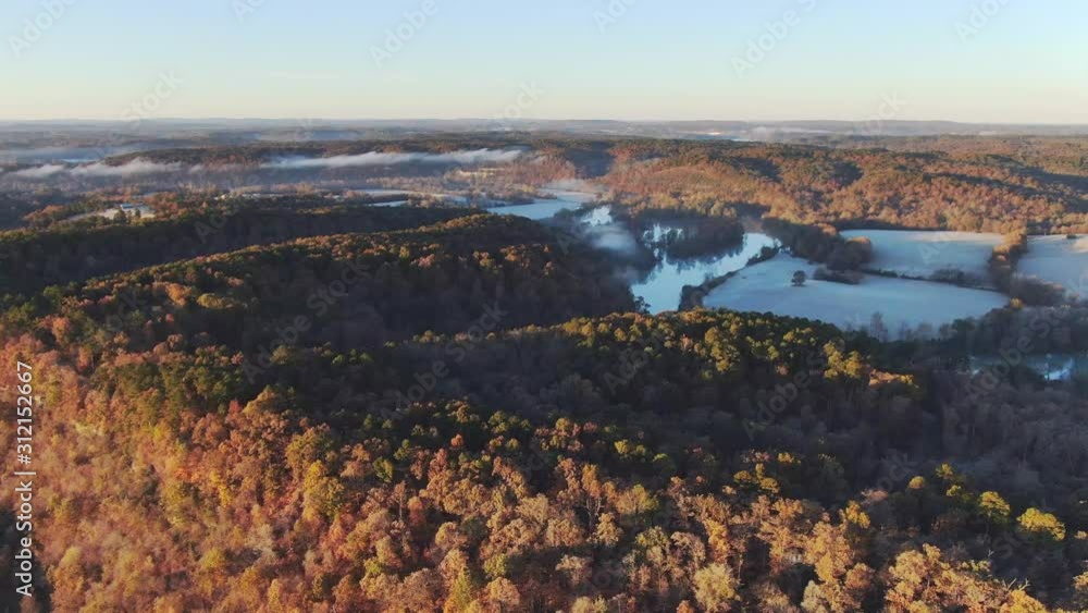 aerial view of Ozark mountain fall colors with White river in the distance aerial view of Ozark mountain fall colors with White river in the distance