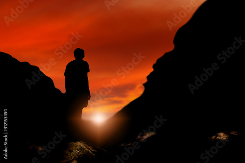 silhouette male stand back on mountains look sky sunrise