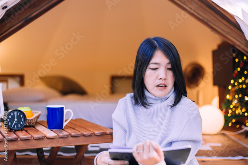 Asian woman drinking coffee and reading book ,Happy and smiling,Positive thinking,Relax time