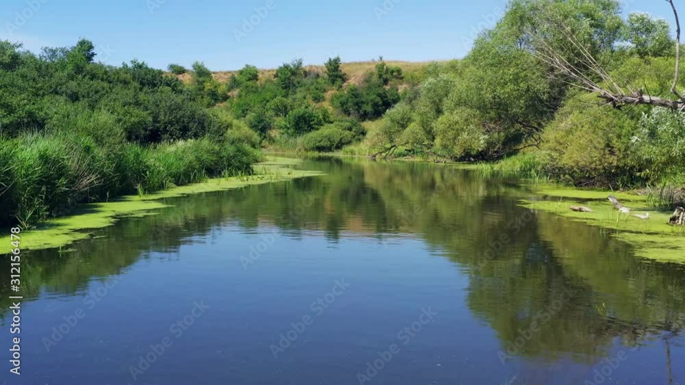 Flying over the river, shooting from a drone. Beautiful aerial view Flying over the river, shooting from a drone. Beautiful aerial view