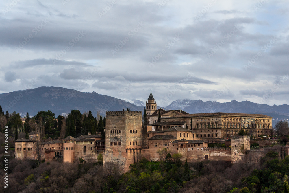 Alhambra on a cloudy day viewed from San Nicolas view point, Granada, Spain