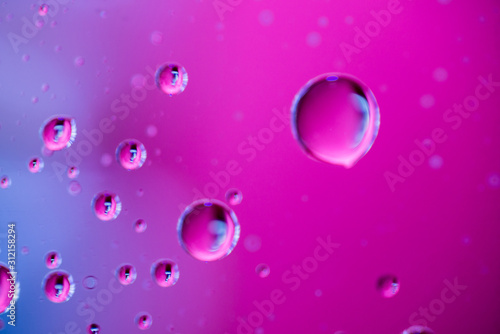 Wallpaper Mural Water droplets on pink and purple background Torontodigital.ca