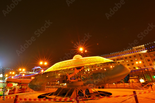 Kazakhstan, Almaty- FEBRUARY 2, 2019: Carousel. Blurred spinning carousel on a dark evening in an amusement Park with lights blurring together 