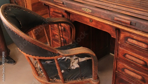 Old western chair at desk