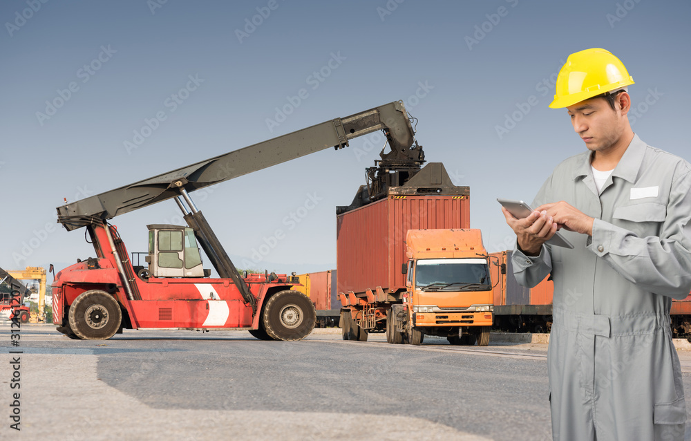 Foreman stand check tablet on front forklift loading Containers box Foreman stand check tablet on front forklift loading Containers box