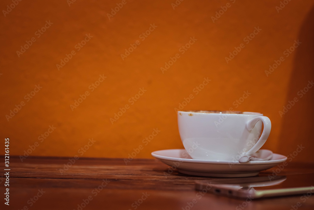 Fototapeta premium Coffee in the morning . Coffee and smartphone and for working time.