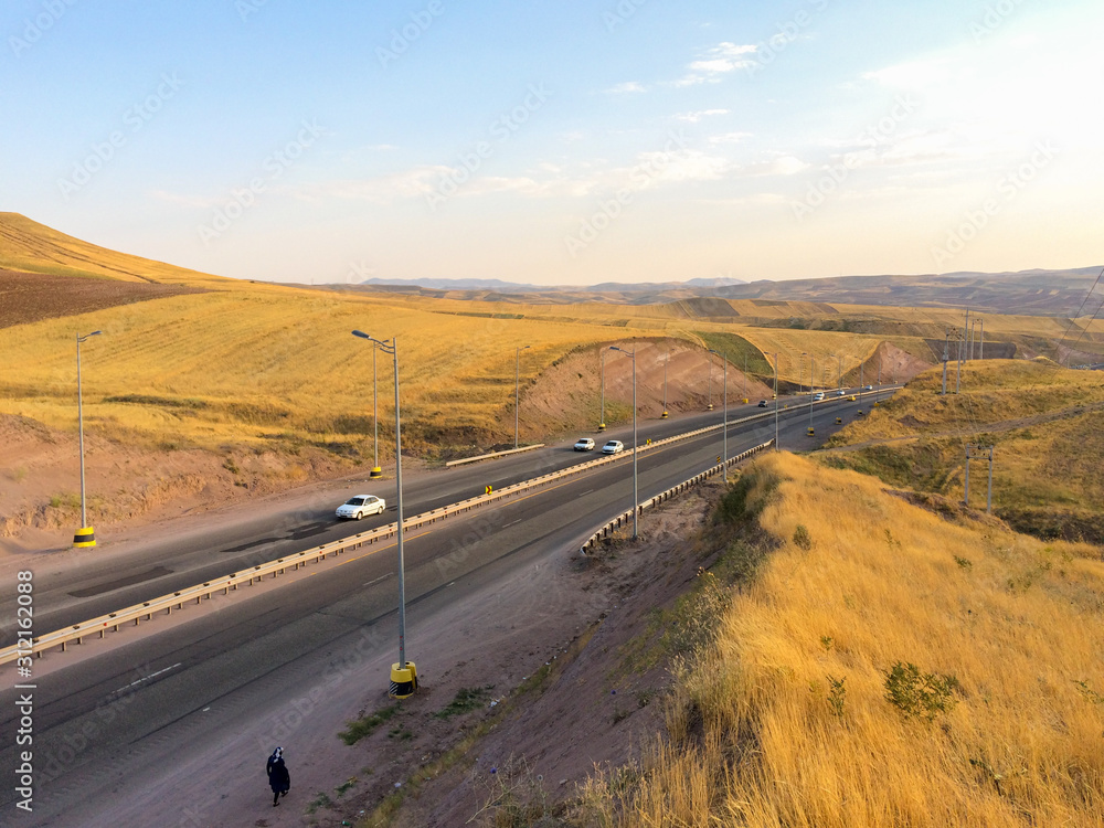 Qazvin, GILAN, IRAN 05 05 2019: Cross the road between the plains.
