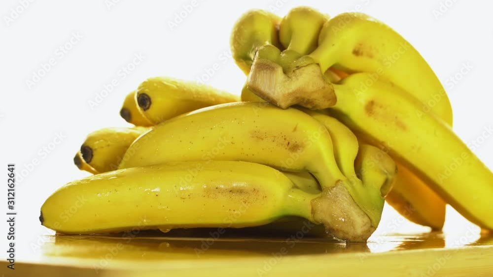 Bananas. A bunch of bananas rotates, an interesting foreshortening, an advertising shot. Bananas. A bunch of bananas rotates, an interesting foreshortening, an advertising shot.
