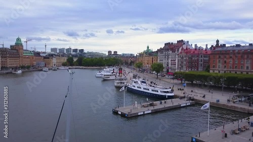 HD droneshot from the harbor in the middle of Stockholm, revealing parts of Stockholm in the background. photo