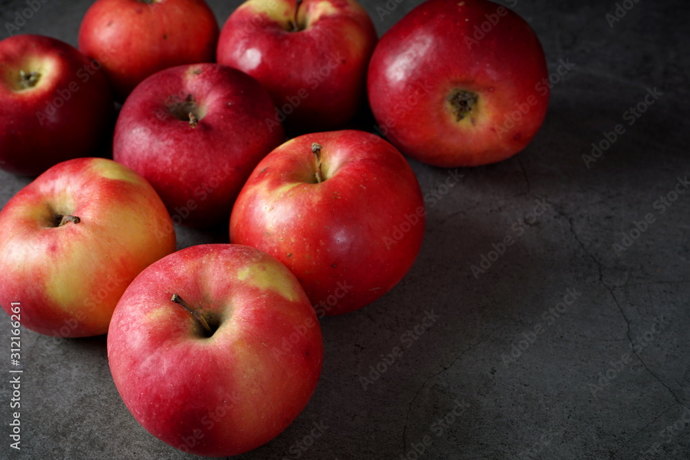 Red apples on a dark background. Selective focus Red apples on a dark background. Selective focus
