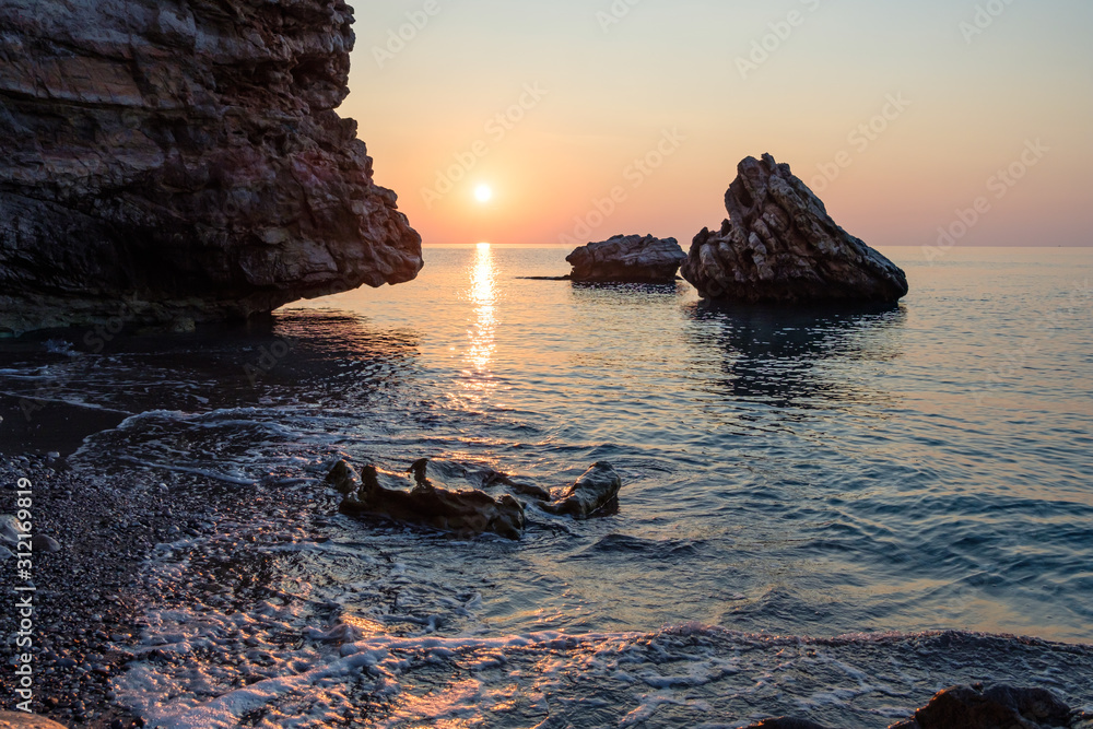 sea dawn on the rocky coast of the Mediterranean sea