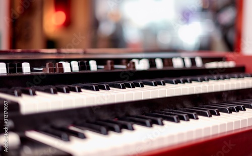Fotografía A double manual vintage organ keyboard with tone stops in shallow depth of field