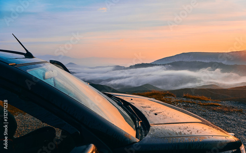 Off Road Adventure at Sunrise and Beautiful Clouds over the Montains