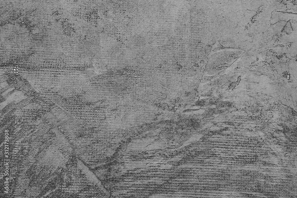 Naklejka premium Texture of a concrete wall with cracks and scratches which can be used as a background