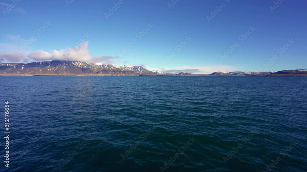 View of the beautiful landscape in the Reykjavik bay from a moving boat View of the beautiful landscape in the Reykjavik bay from a moving boat
