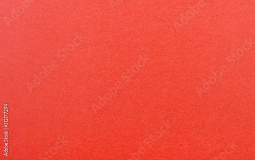 Plain red background. Red cardboard. Red paper texture background. Abstract geometric flat composition. Copy spaces
