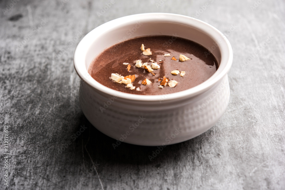Sweet Ragi Malt / Healthy Ragi Porridge in a bowl garnished with crushed dry fruits Sweet Ragi Malt / Healthy Ragi Porridge in a bowl garnished with crushed dry fruits