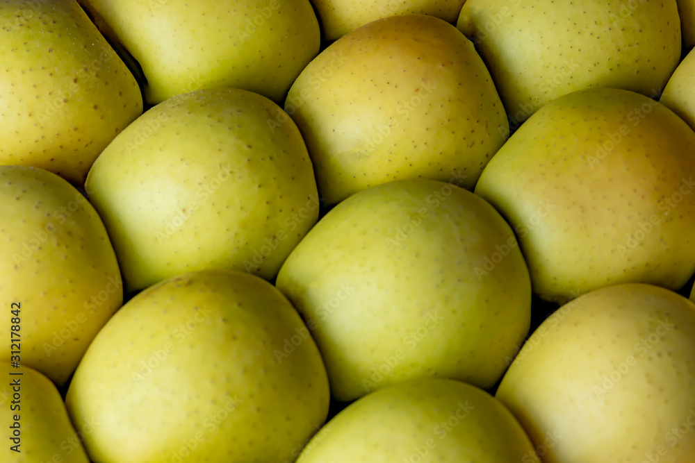 Bunch of green apples in supermarket. .Green apples in a vegetable shop. Background from green apples. Bunch of green apples in supermarket. .Green apples in a vegetable shop. Background from green apples.