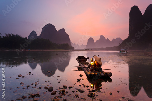 Tablou canvas Cormorant fisherman on the Li River, near the town of Xingping in Guangxi province, China