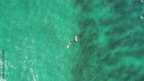 Paddle boaters on the ocean in Queensland, Australia photo