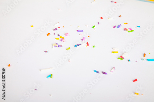 colorful sprinkles candies white studio background