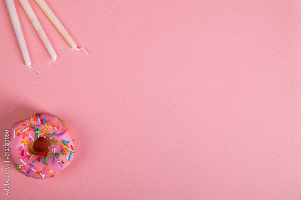 colorful doughnuts candles pink background studio