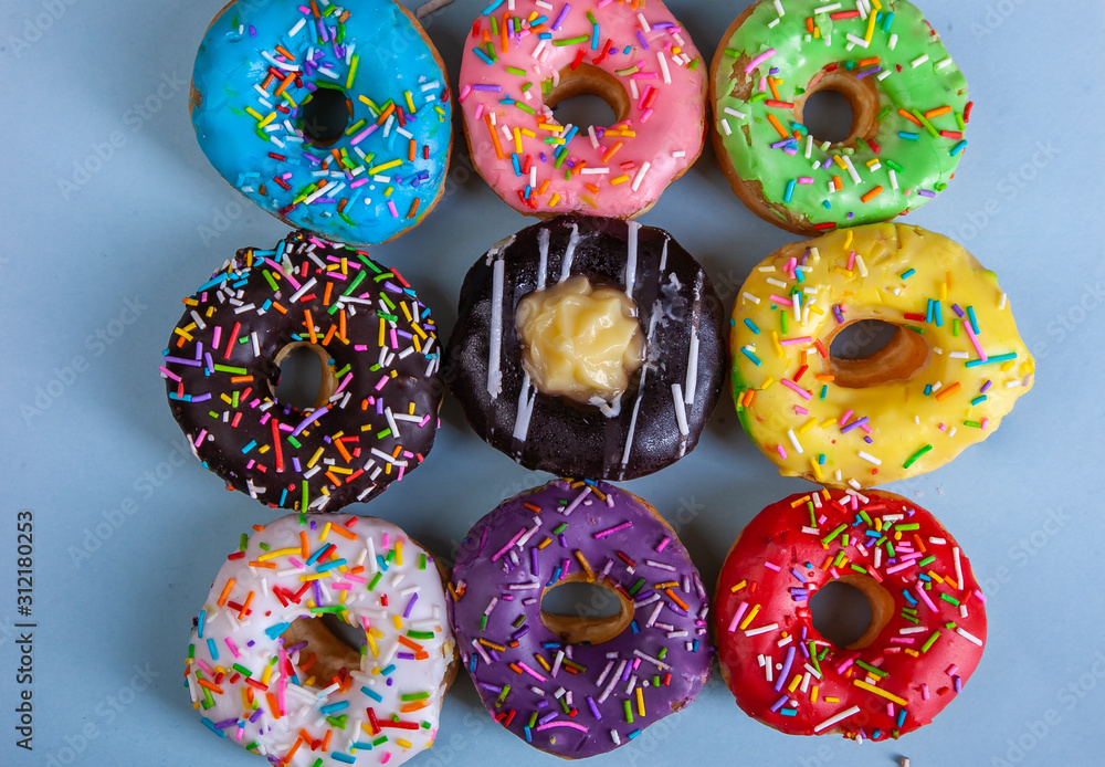 colorful doughnuts blue background studio