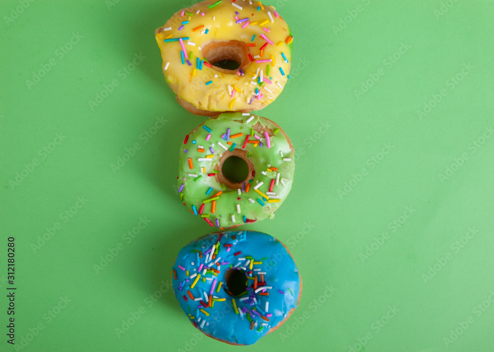 colorful doughnuts green background studio