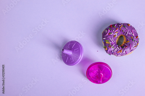 colorful doughnut dreidel purple background studio
