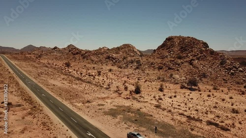 4K aerial drone video of gravel plains and granite rock formations near town Karasburg, B1 highway in the south of Namibia and dry waterless hot bush savanna in Grunau District, southern Africa photo