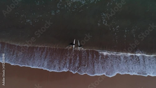 Surfers at a beach in Sydney Australia photo