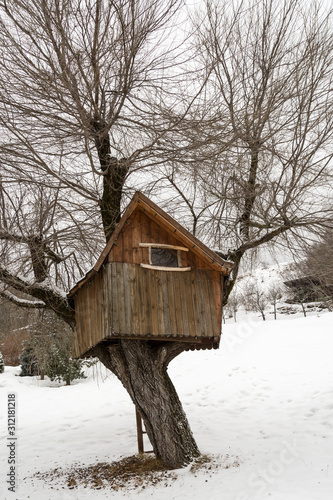  wooden tree house, winter in Andalo, Dolomites, Italy © darioracane
