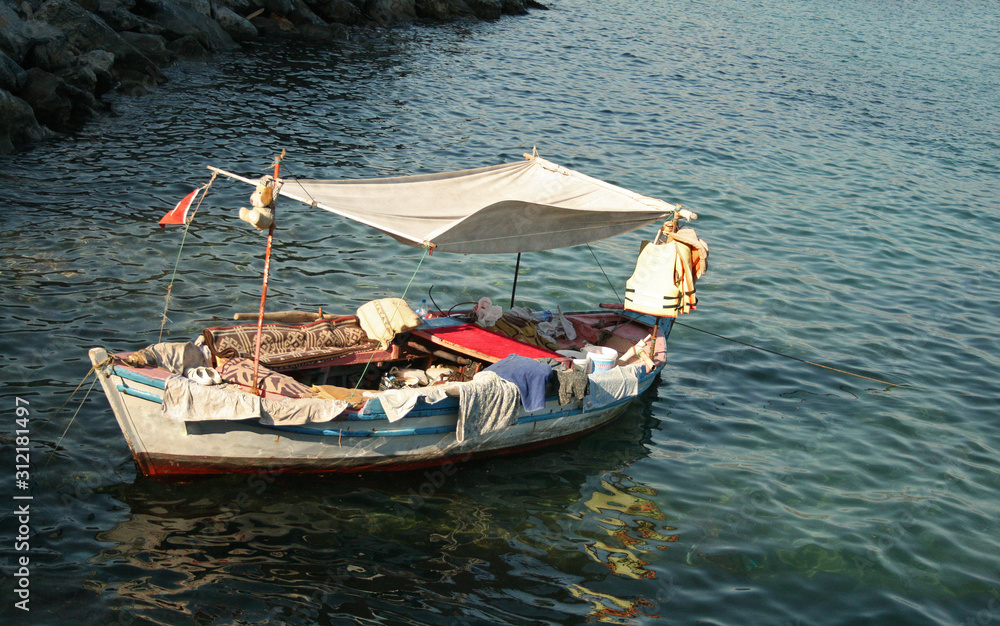 travel photography of old fishing boat on the sea waves travel photography of old fishing boat on the sea waves