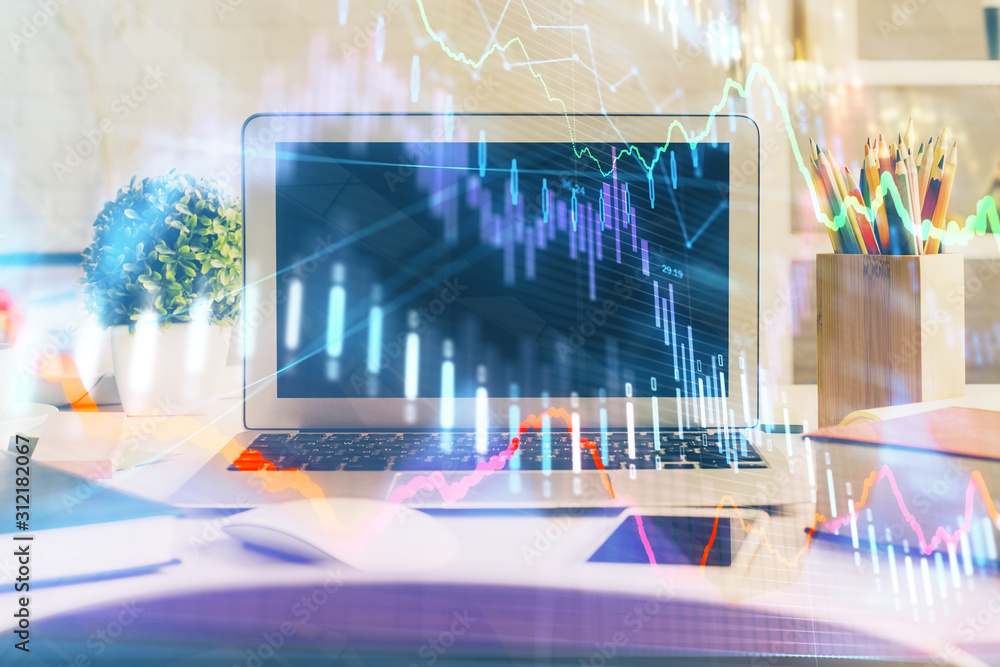Forex market chart hologram and personal computer background. Double exposure. Concept of investment. Forex market chart hologram and personal computer background. Double exposure. Concept of investment.