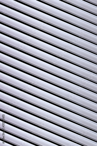 Aluminium pipes vertical black background