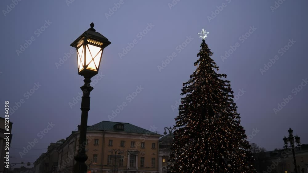 Street lamp on the background of beautiful Christmas tree Street lamp on the background of beautiful Christmas tree