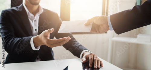 close up hand of employee receive bonus from manager photo