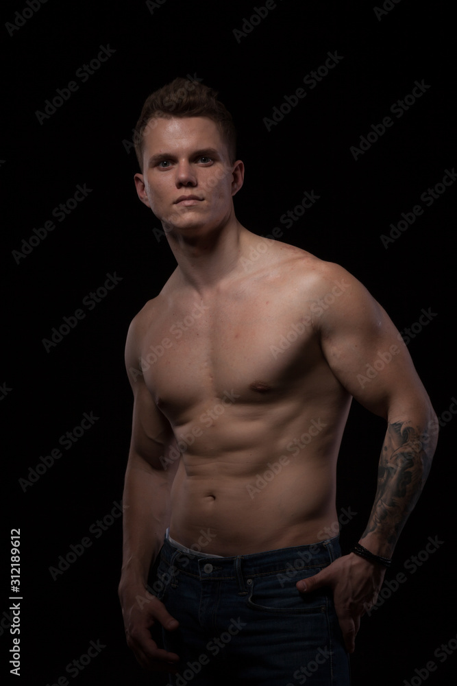 portrait of a beautiful fashionable strong man with a bare torso portrait of a beautiful fashionable strong man with a bare torso