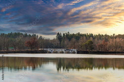 Old stone bridge across the pond Vitek near Trebon, South Bohemian Region. Czech Republic. photo