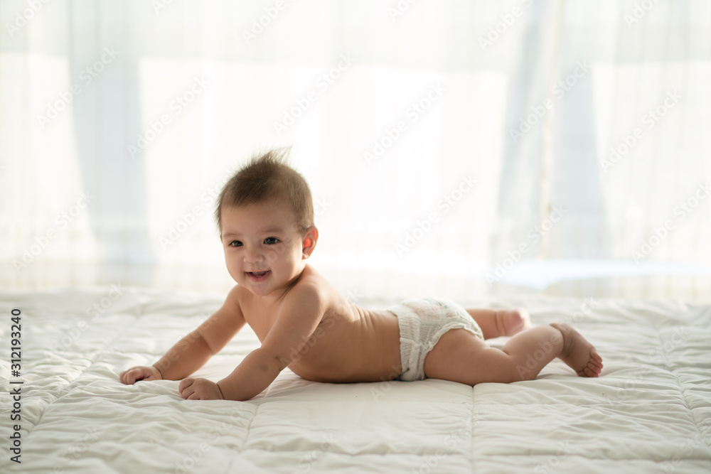 baby on the bed.