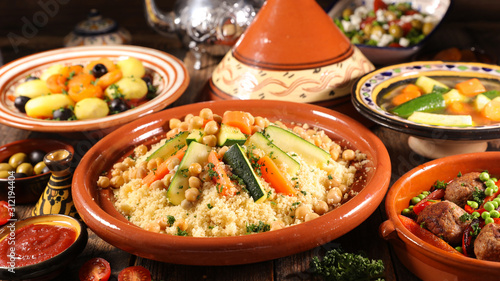 assorted of traditional moroccan tajine with dried fruits and spices photo
