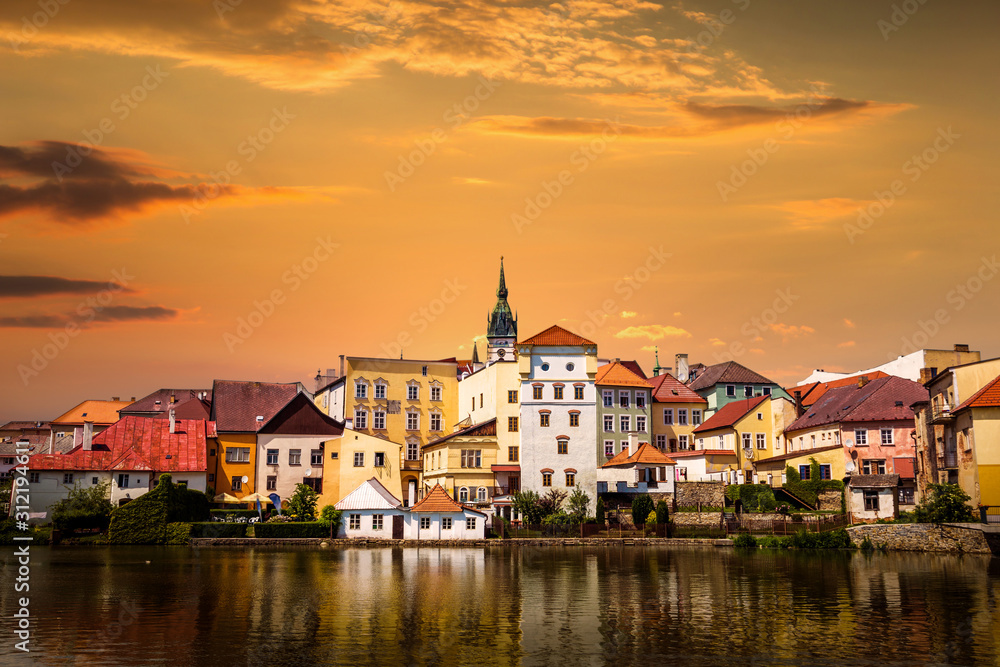 Jindrichuv Hradec panoramic cityscape with Vajgar pond in the foreground on a sunset. Czech Republic.