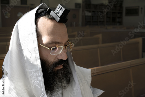 Jewish prayer, Jew praying with tefillin and tallit photo