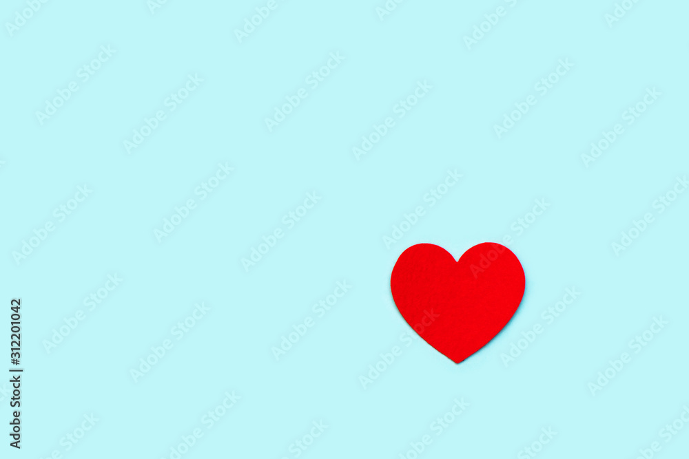 Red decorative heart on a blue background.