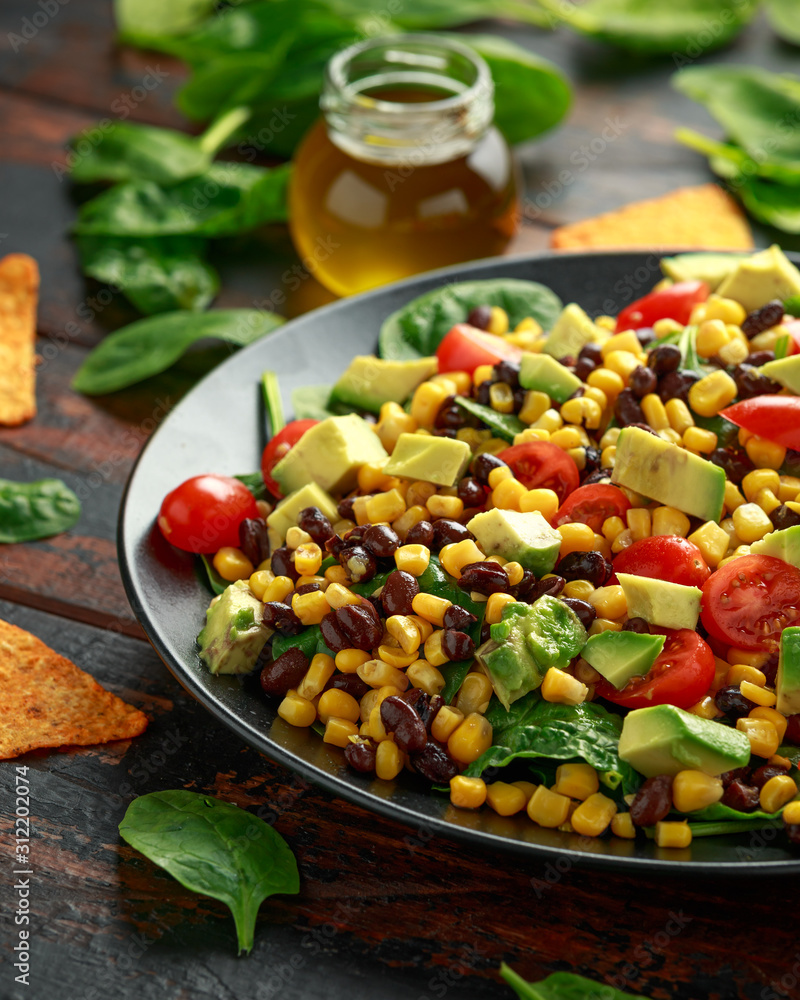 Mexican Salad with Avocado, Black Beans, sweet corn, spinach, tomatoes and Tortilla chips Mexican Salad with Avocado, Black Beans, sweet corn, spinach, tomatoes and Tortilla chips