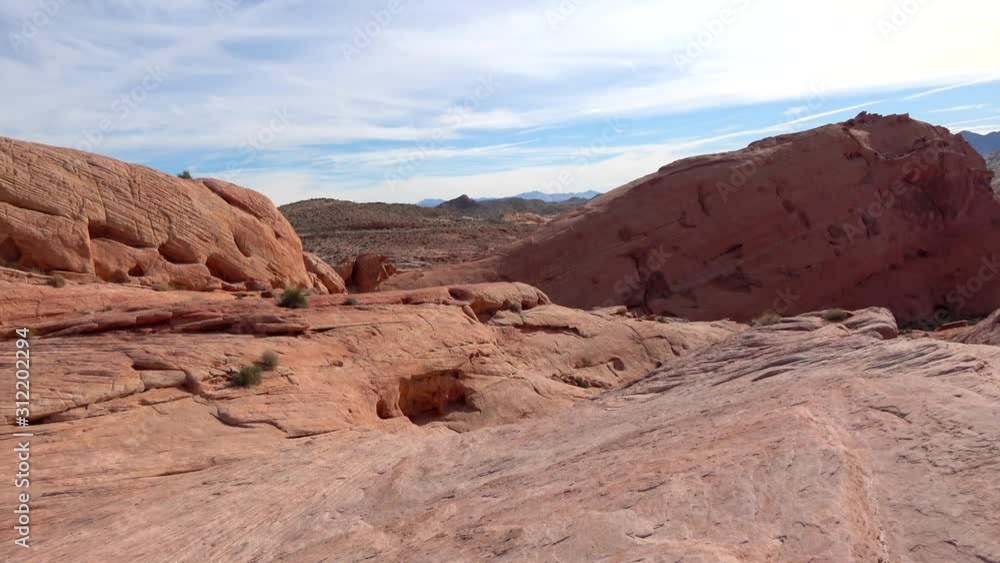 4K. Panoramic view of one of the waves of fire in the Valley of Fire, in the state of Nevada. Quiet and natural tourist place, after many years these rocks were formed. Nature concept. 4K. Panoramic view of one of the waves of fire in the Valley of Fire, in the state of Nevada. Quiet and natural tourist place, after many years these rocks were formed. Nature concept.