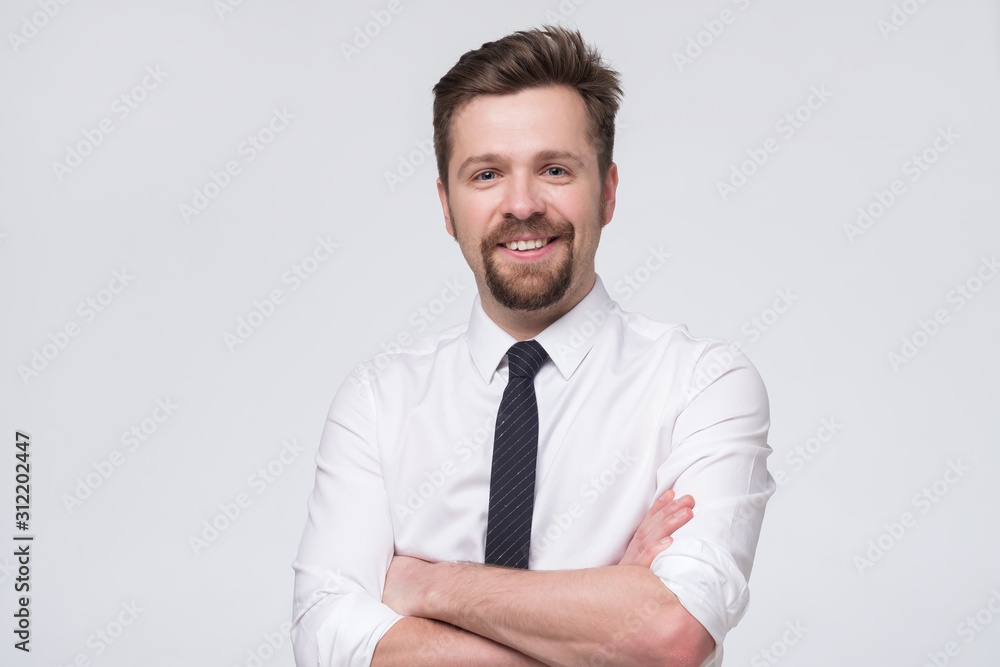 Handsome european businessman in white formal shirt and black tie standing in fr RealPeopleStudio Foto Poster Wandbilder bei EuroPosters