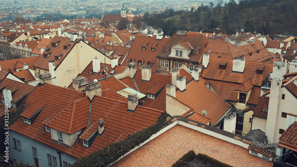 Beautiful view of red roofs in the city Prague from the Prague Castle, Czech Republic