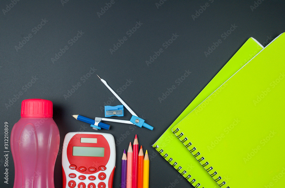 Various school supplies. Studying, education and back to school concept. Black background and selective focus.